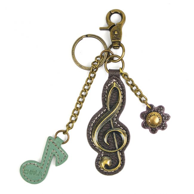 CHALA Treble Clef Keychain, Purse Charm Conveniently small, fun, and functional. Hold your keys with style! Antique bronze toned Treble Clef key chain Comes with bonus flower and music note charms Easy to attach onto a bag, luggage, or keys! Materials: Metal, Vegan Leather