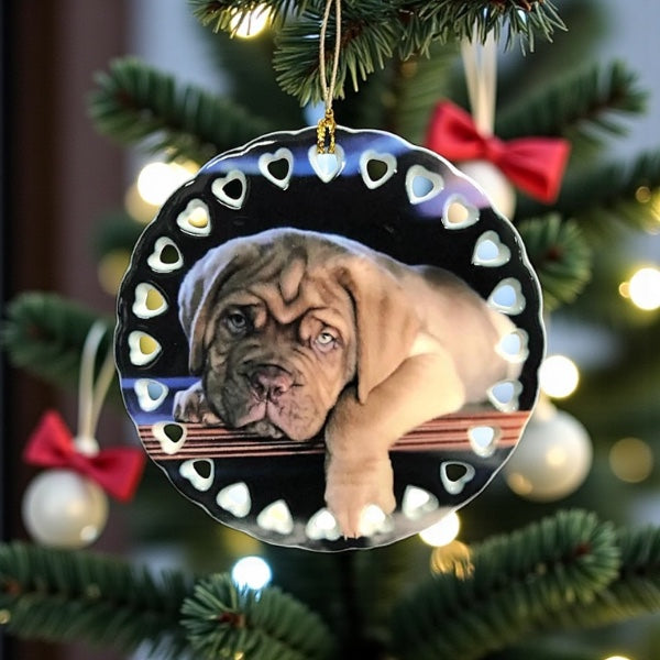Decorative Christmas ornament with a dog's face on a tree