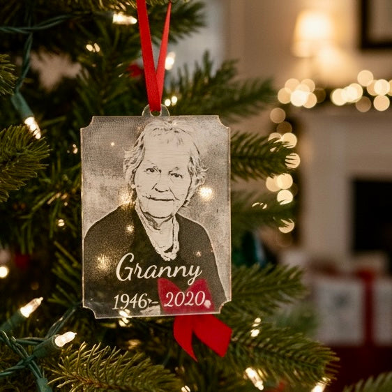 Memorial ornament with 'Granny' and birth/death year on a Christmas tree.